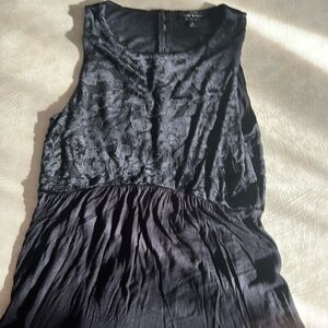 Black sleeveless waisted top